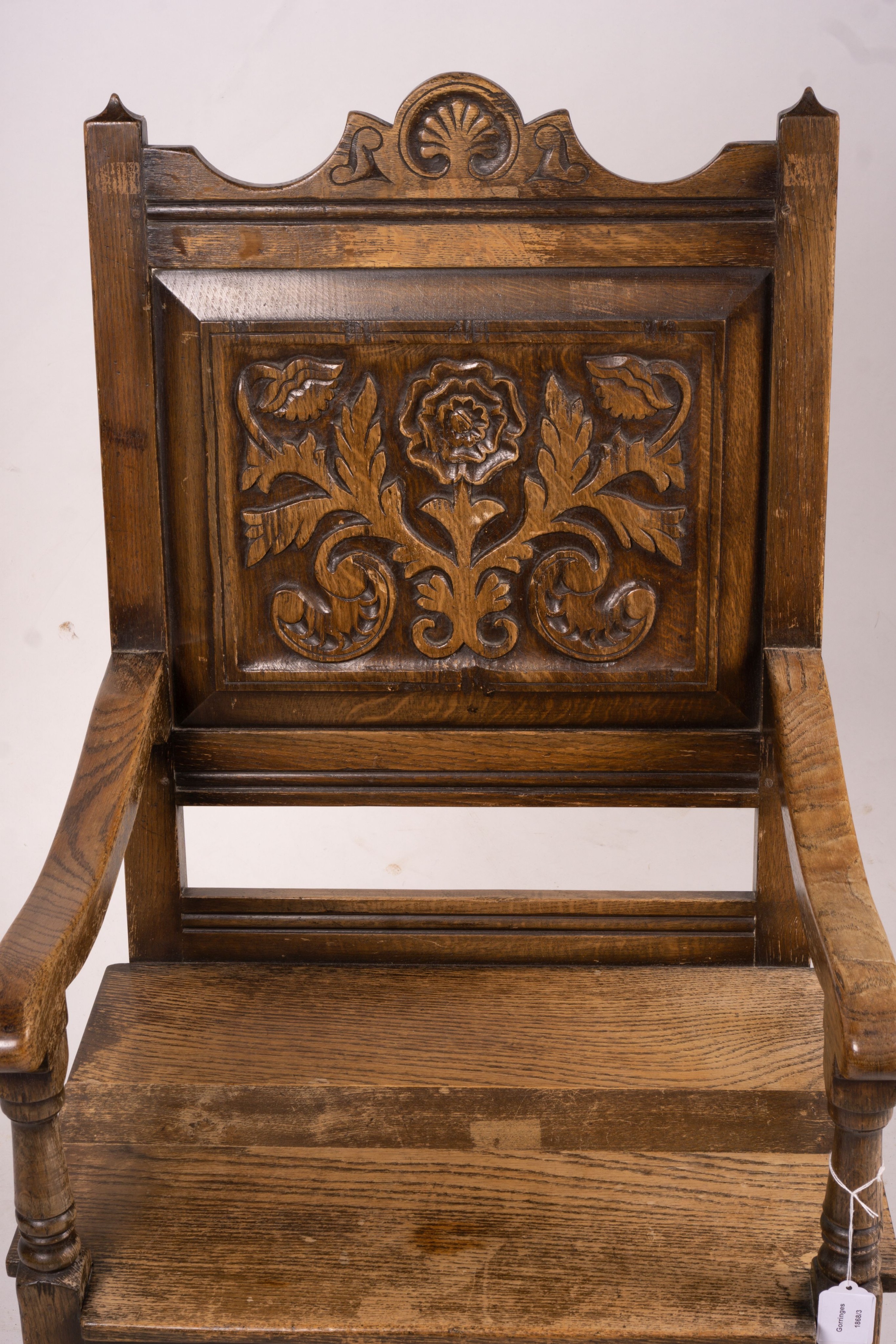 An early 20th century carved oak wainscot chair